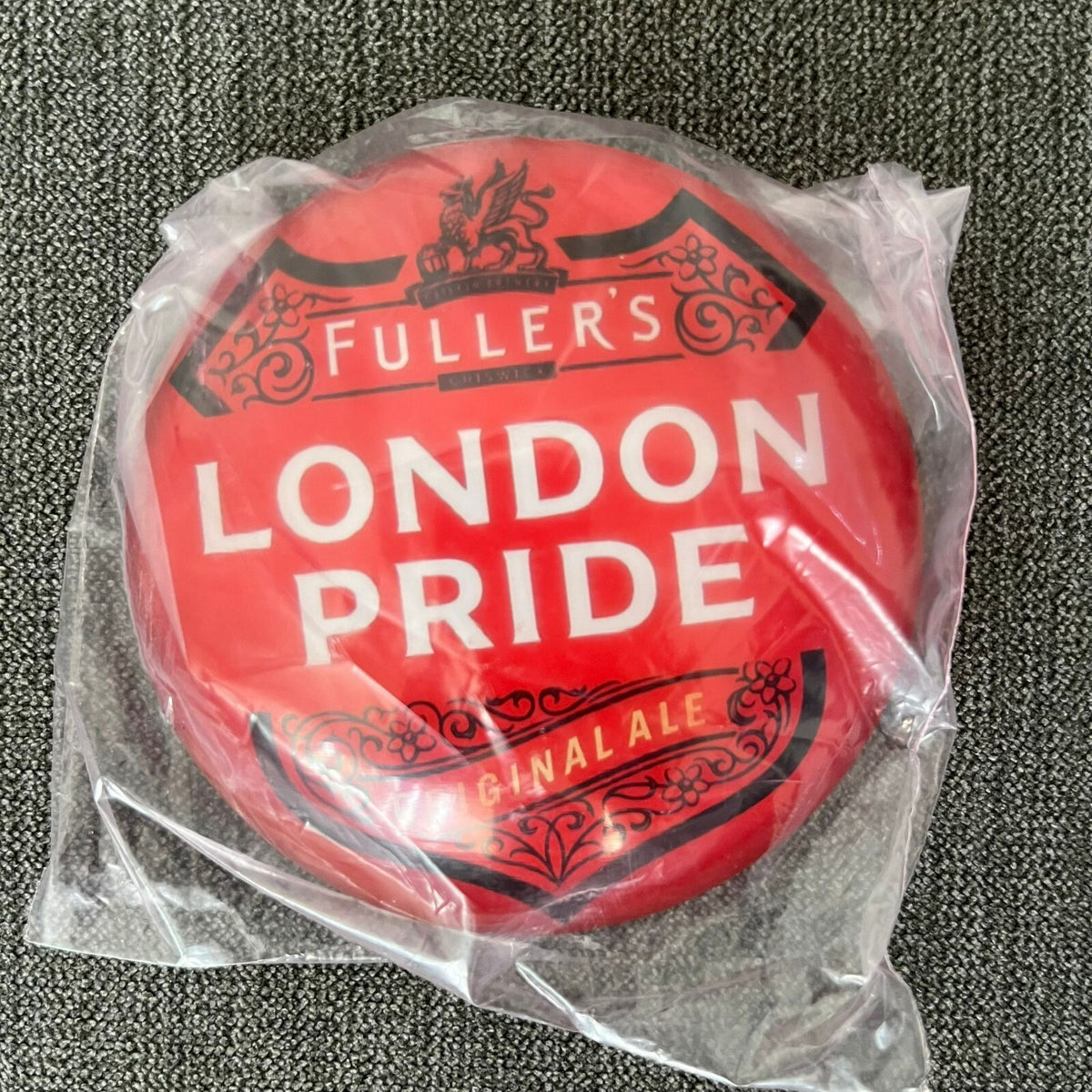 London Pride badge in its packaging