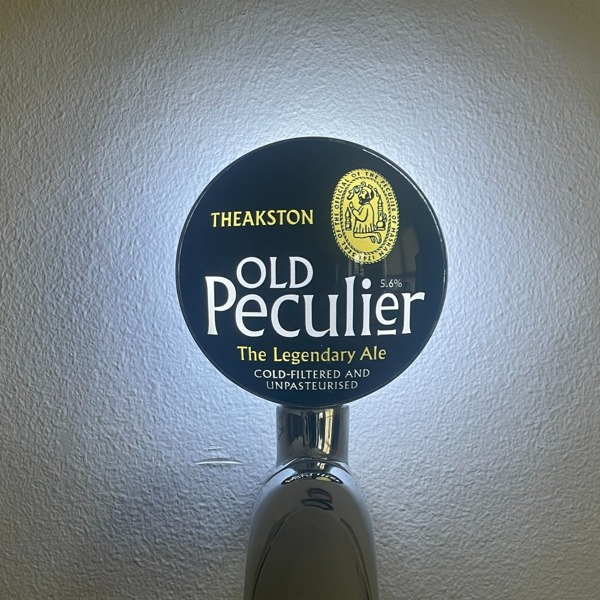 Theakston Old Peculier badge lit up on a beer tap