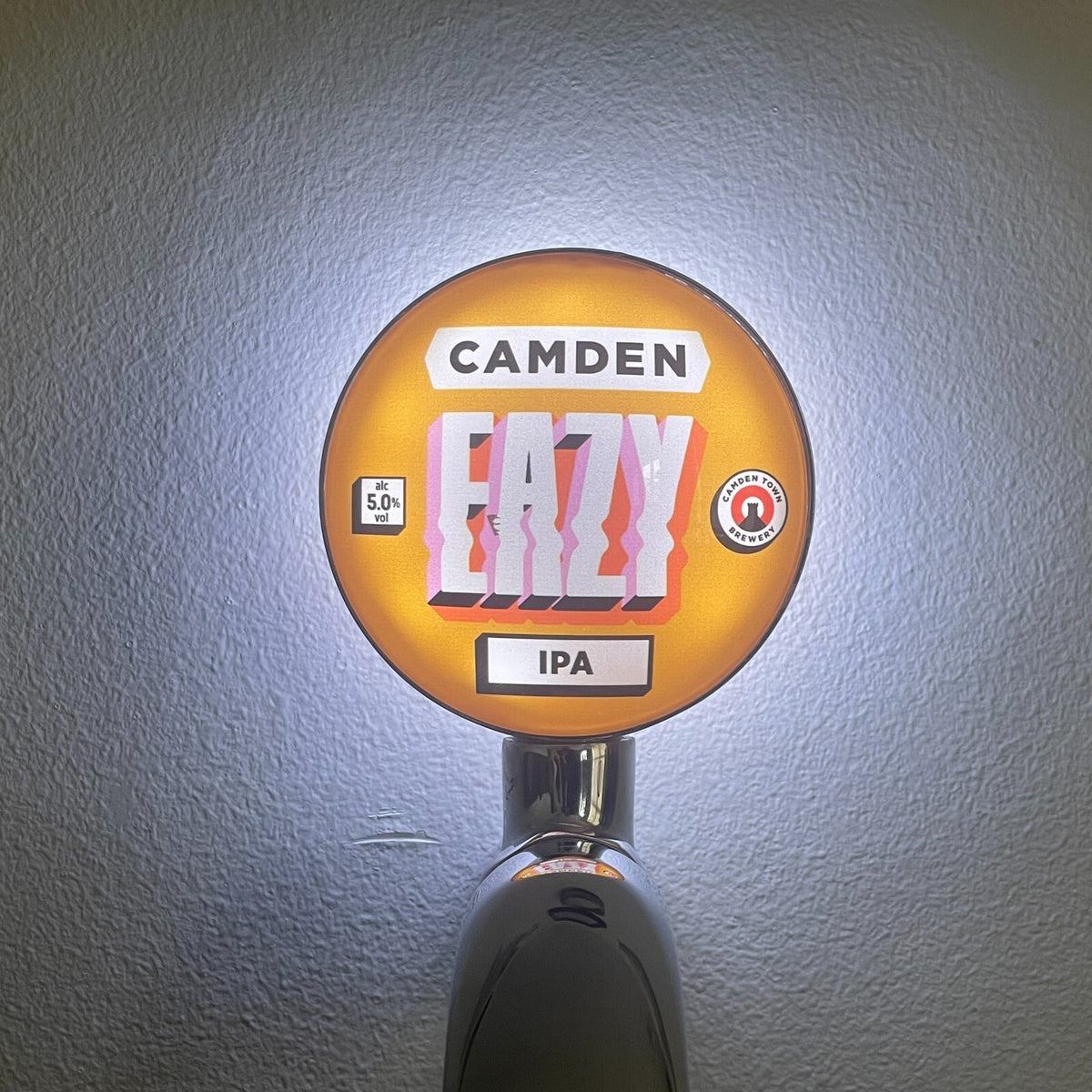 Camden Eazy IPA badge lit up on a beer tap