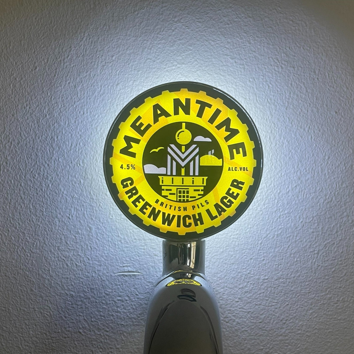 Meantime Greenwich Lager badge lit up on a beer tap