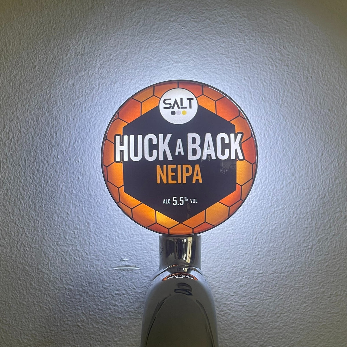 Salt Huckaback NEIPA badge lit up on a beer tap