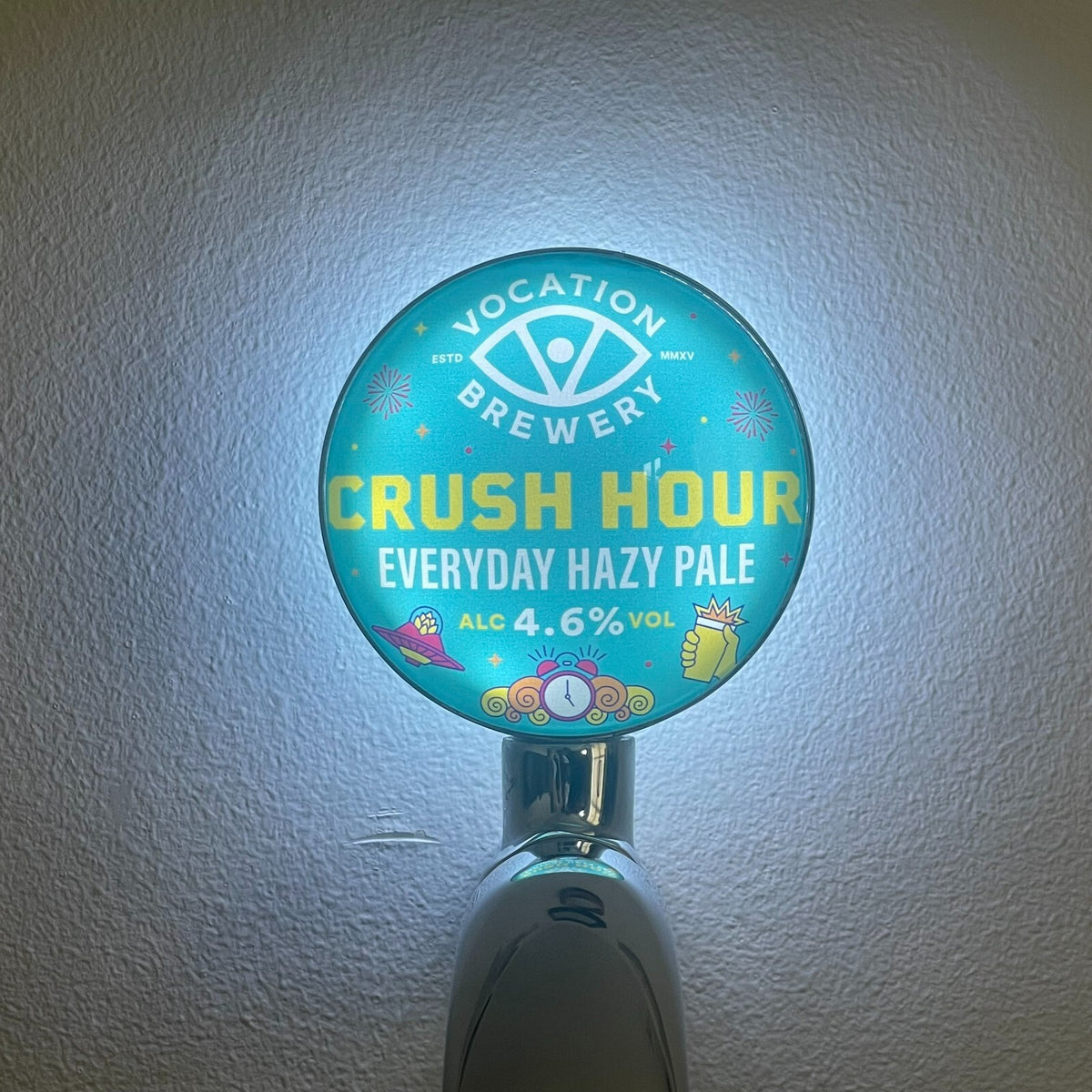 Vocation Crush Hour badge lit up on a beer tap