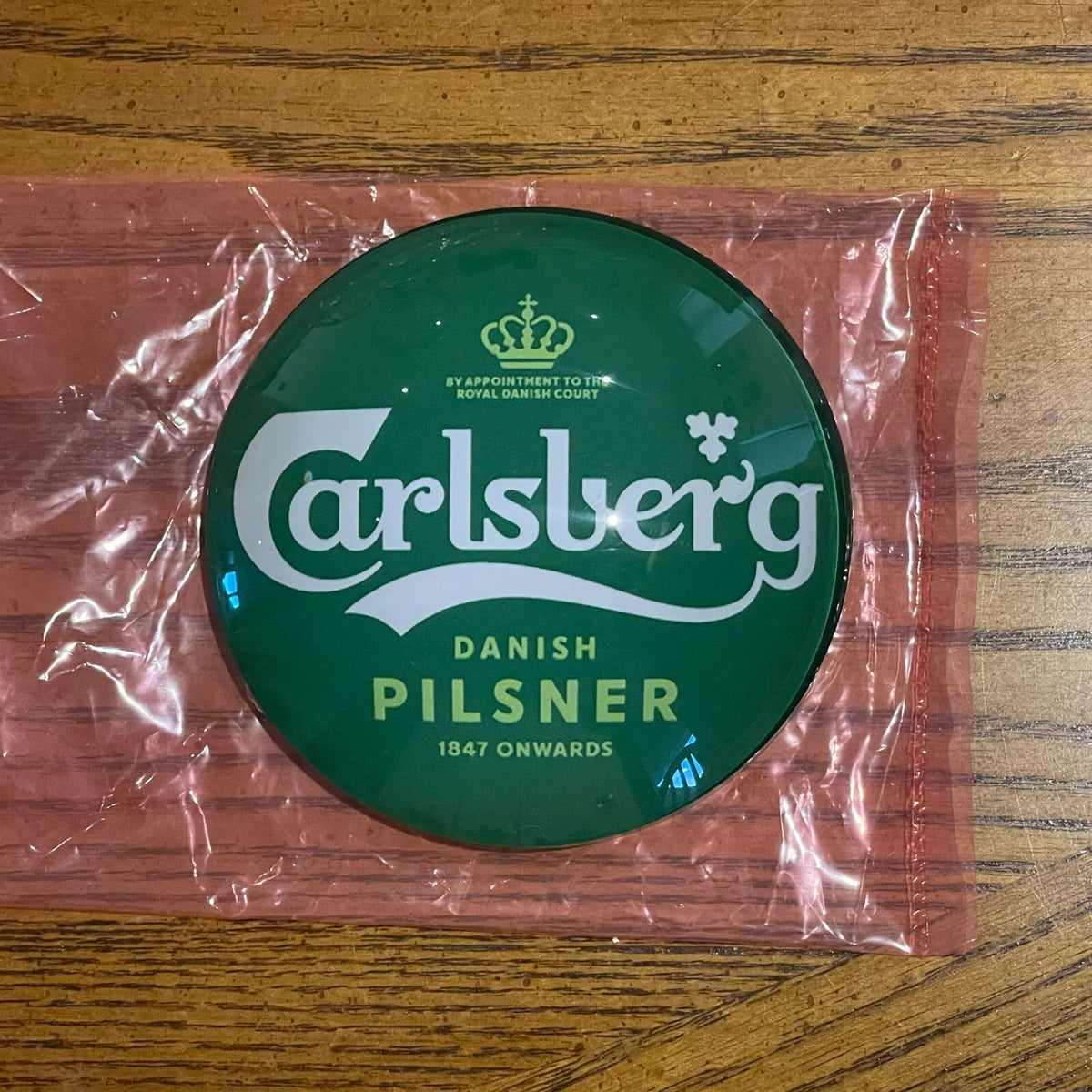 Carlsberg badge in its packaging