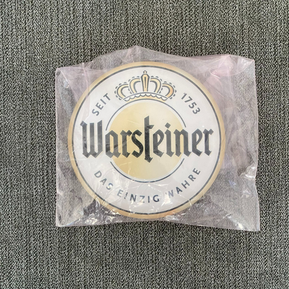 Warsteiner badge in its packaging