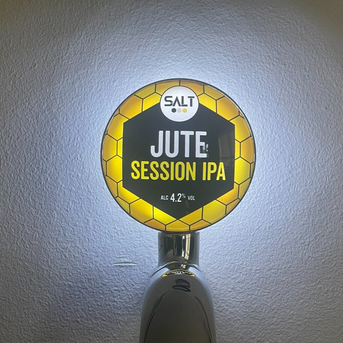Salt Jute Session IPA badge lit up on a beer tap
