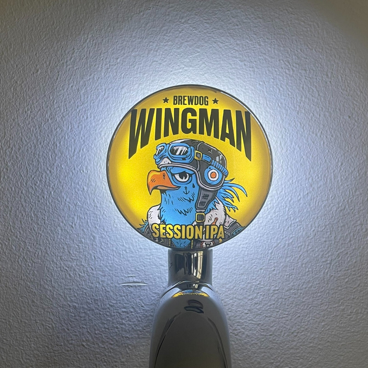 BrewDog Wingman badge lit up on a beer tap