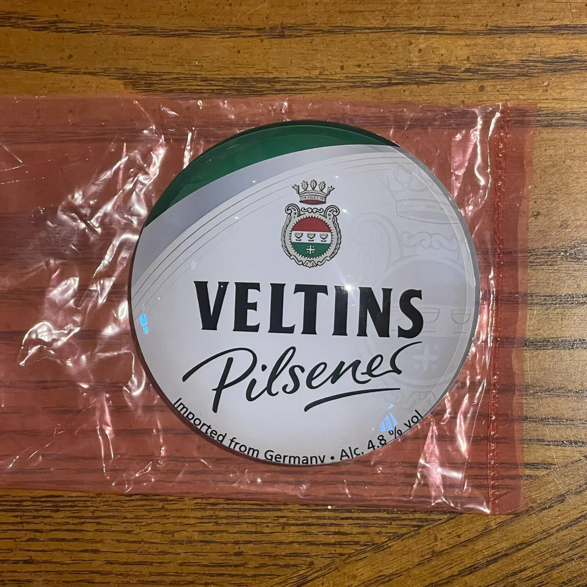 Veltins badge in its packaging