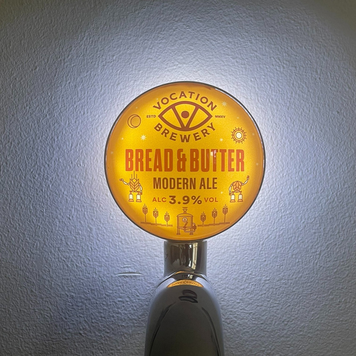 Vocation Bread & Butter badge lit up on a beer tap