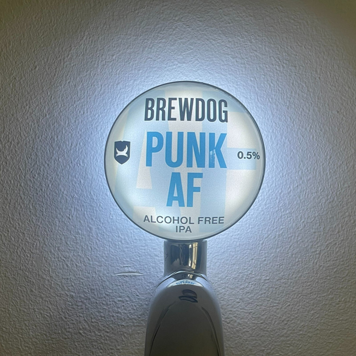 BrewDog Punk AF 0.5% badge lit up on a beer tap