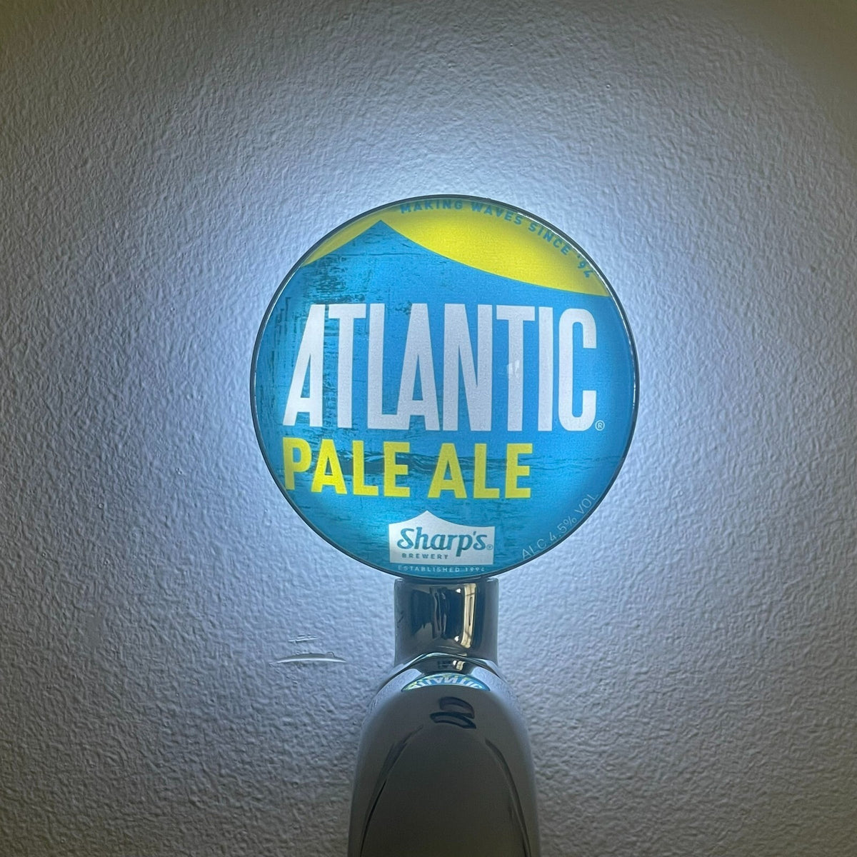 Sharp's Atlantic Pale Ale badge lit up on a beer tap
