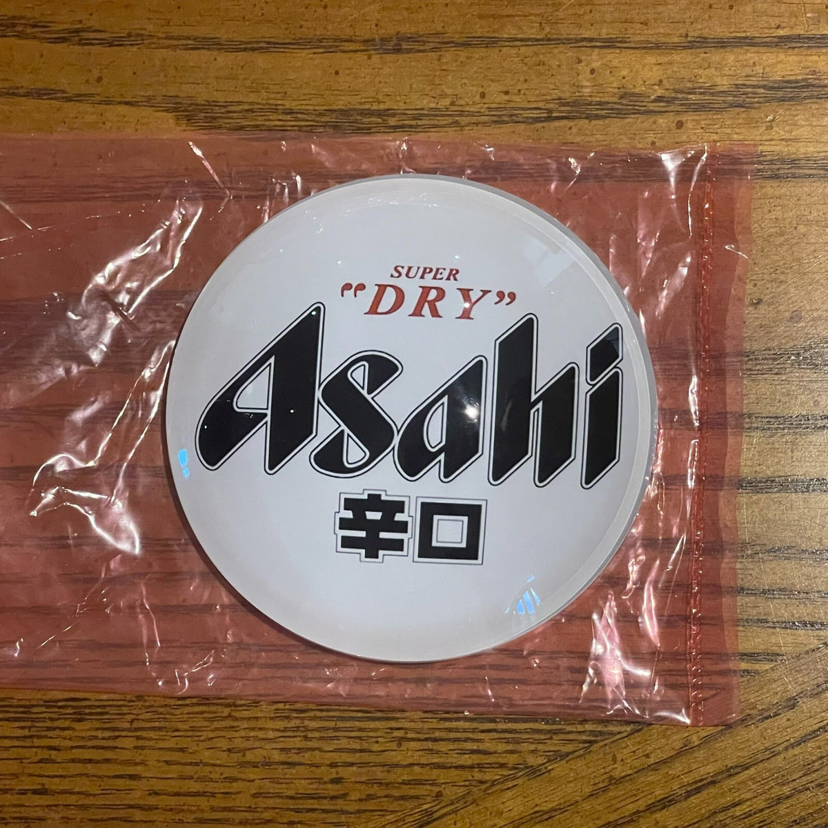 Asahi Super Dry badge in its packaging