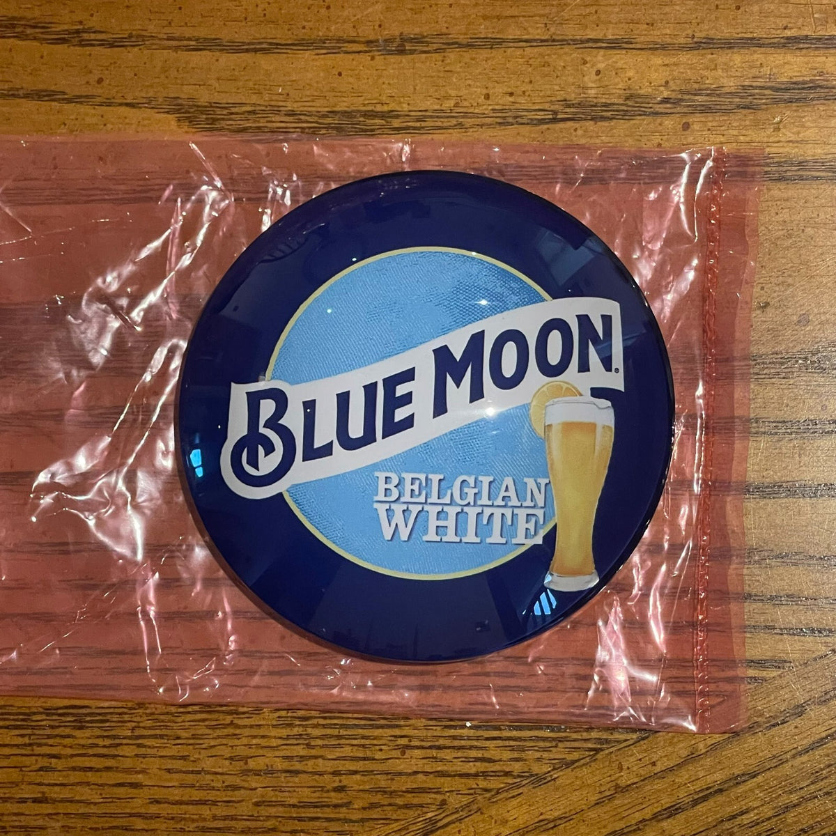 Blue Moon badge in its packaging