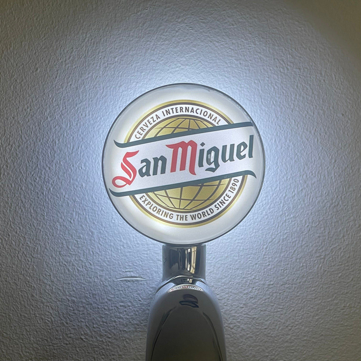San Miguel Classic badge lit up on a beer tap