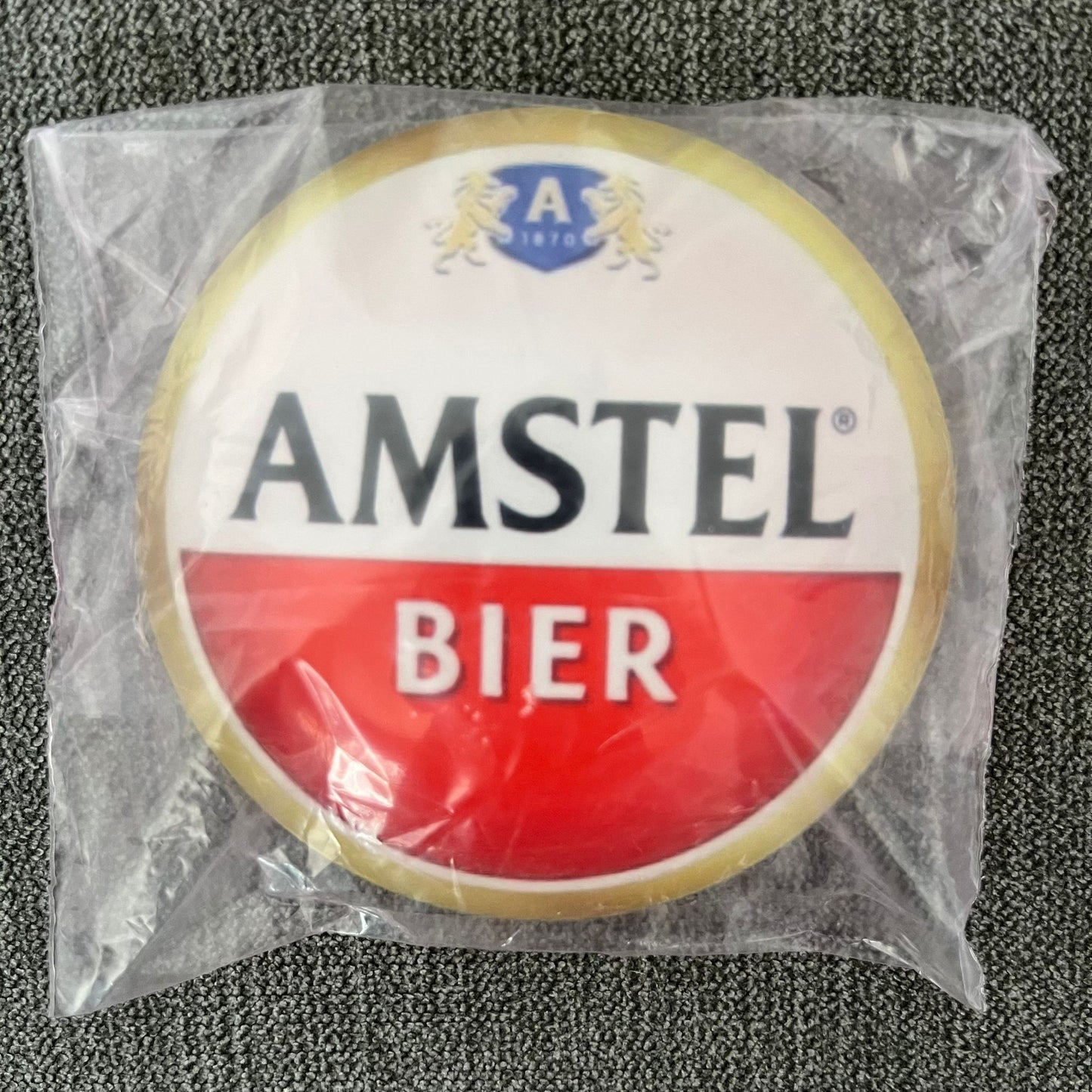 Amstel Badge / Lens