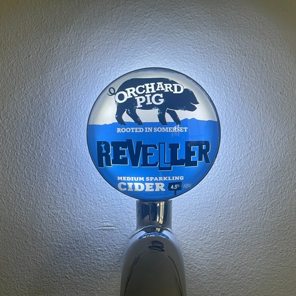 Reveller badge lit up on a beer tap
