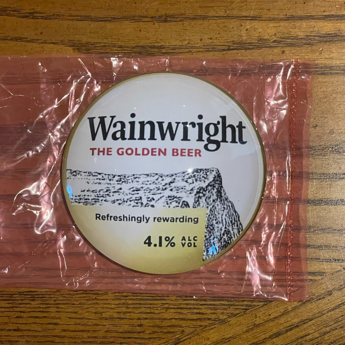 Wainwright badge in its packaging