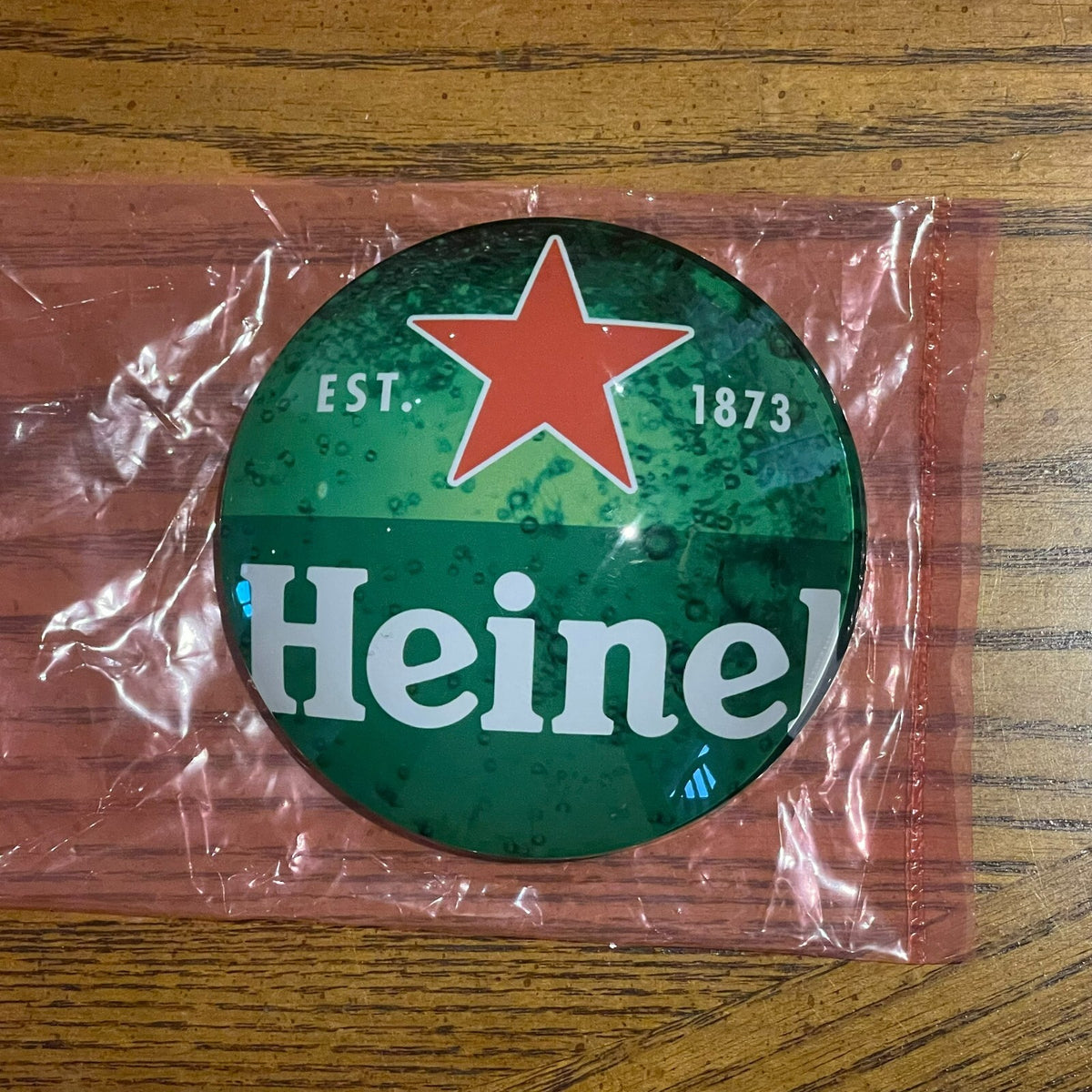Heineken badge in its packaging