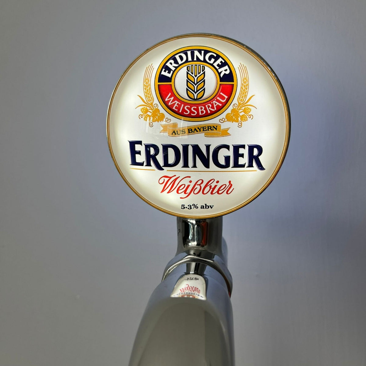 Erdinger badge lit up on a beer tap