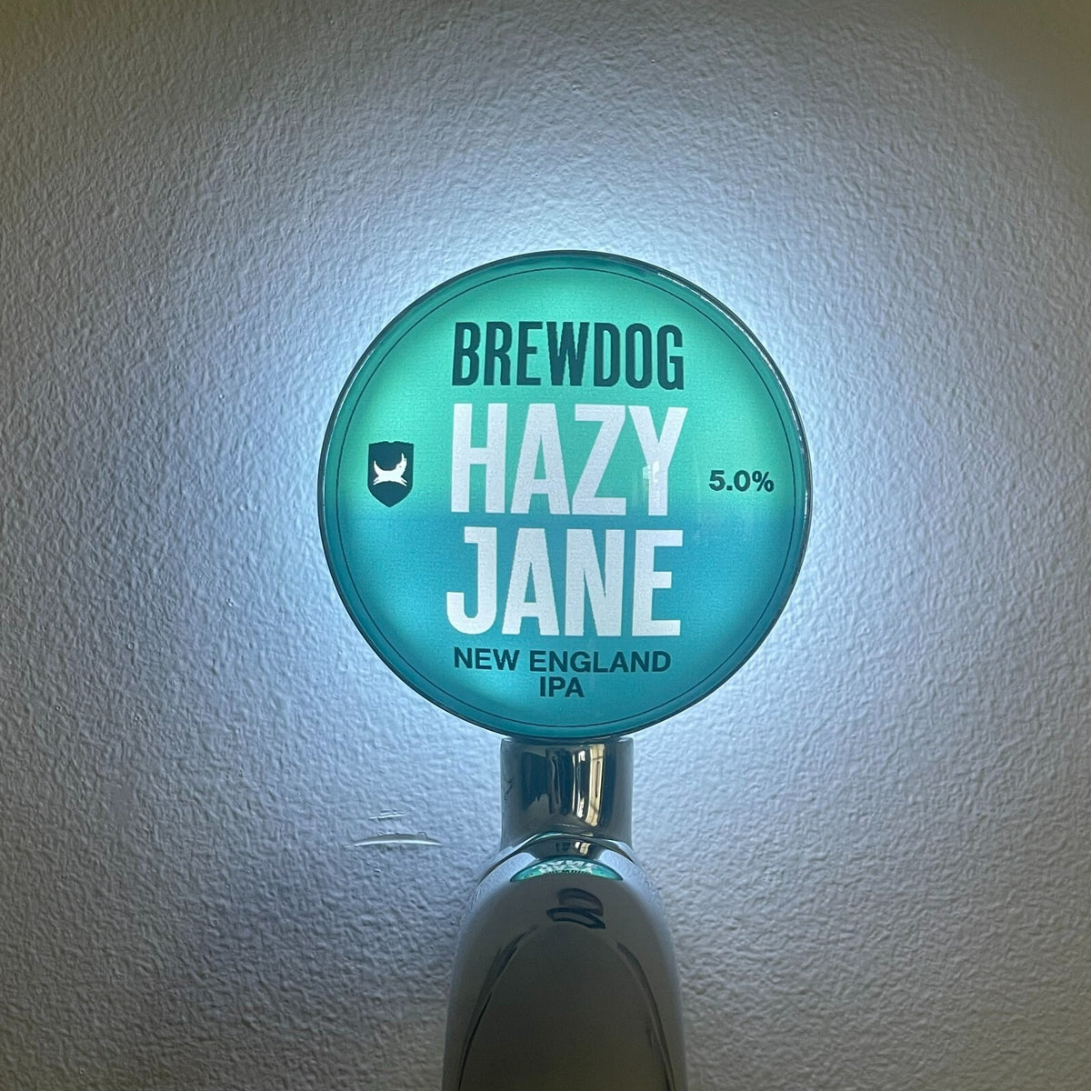 BrewDog Hazy Jane badge lit up on a beer tap