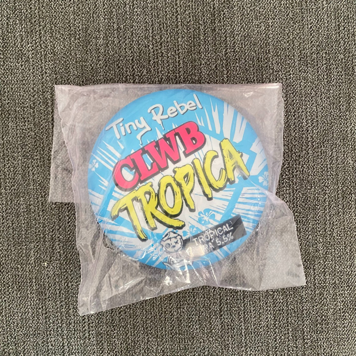 Tiny Rebel Clwb Tropica badge in its packaging