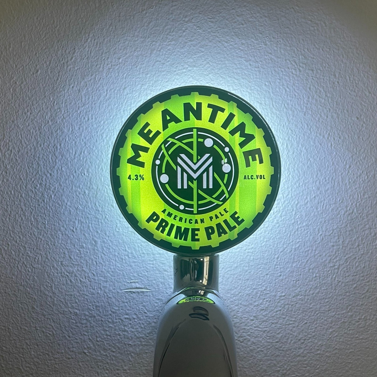 Meantime Prime Pale Ale badge lit up on a beer tap