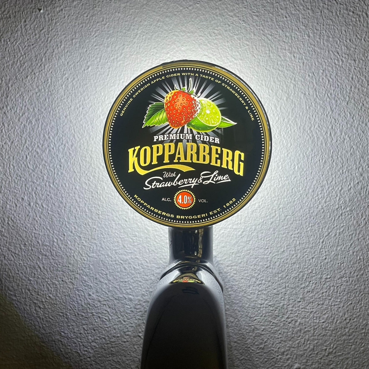 Kopparberg Strawberry & Lime badge lit up on a beer tap