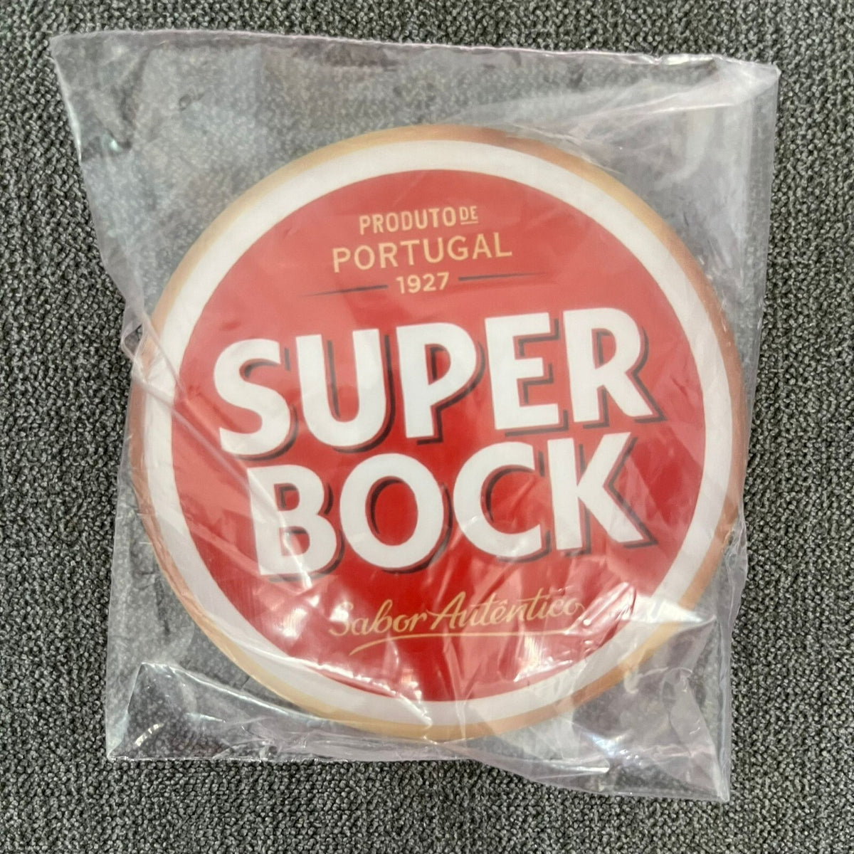 Super Bock badge in its packaging