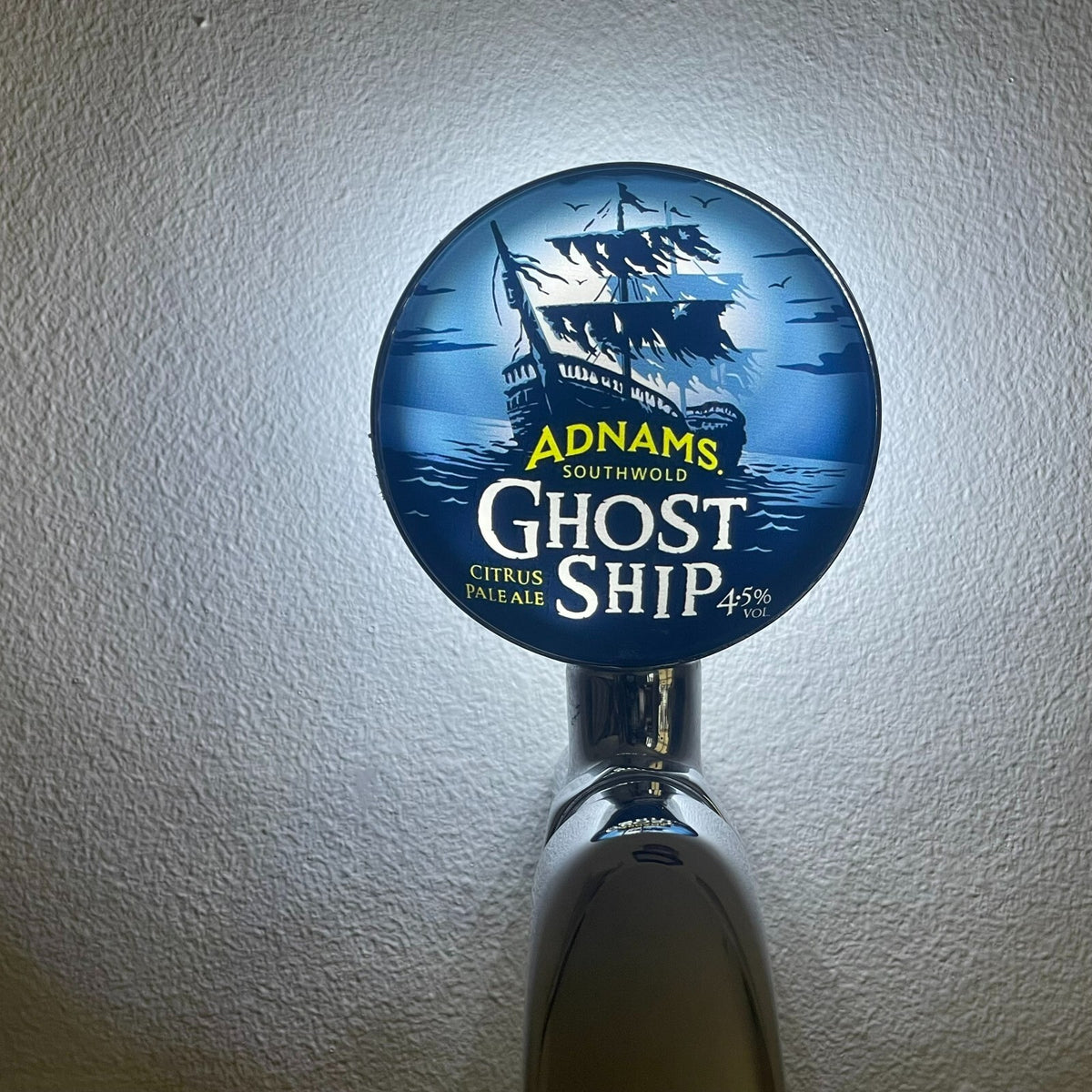 Ghost Ship badge lit up on a beer tap