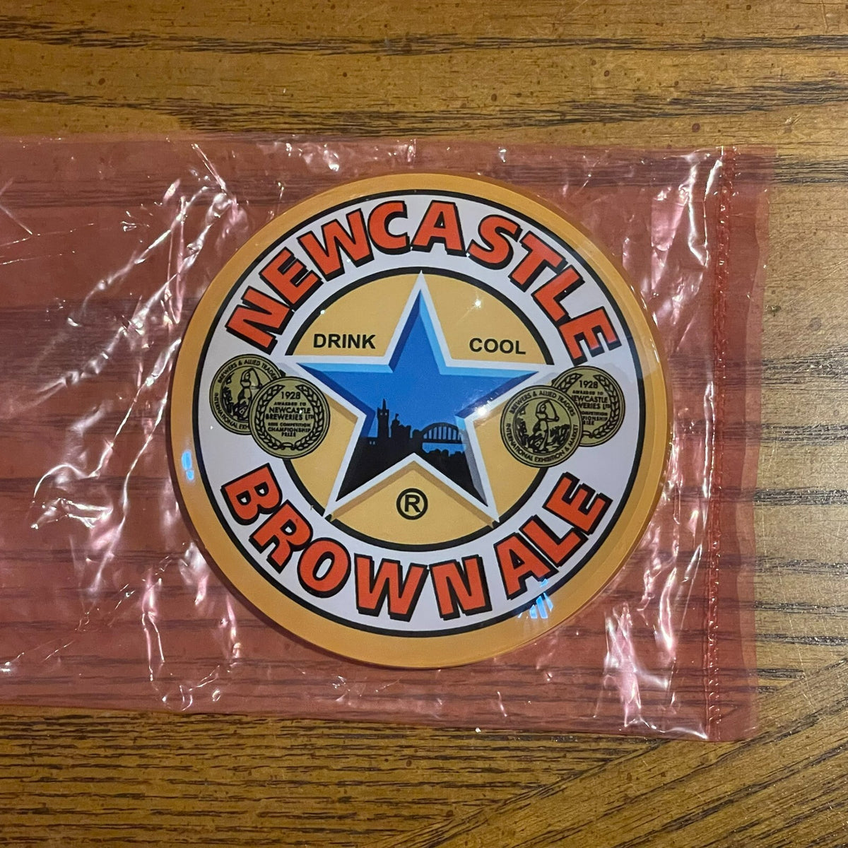 Newcastle Brown Ale badge in its packaging