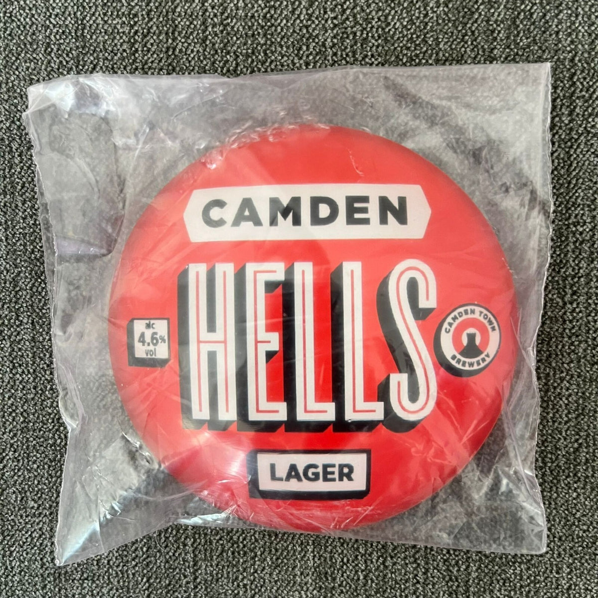 Camden Hells Lager badge in its packaging