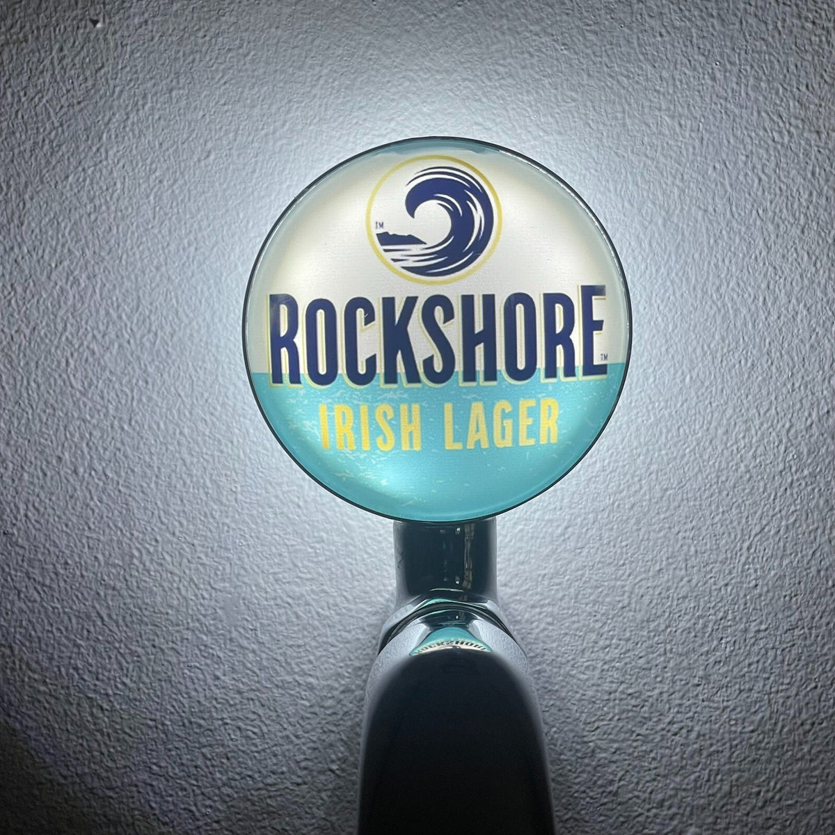 Rockshore Irish Lager badge lit up on a beer tap