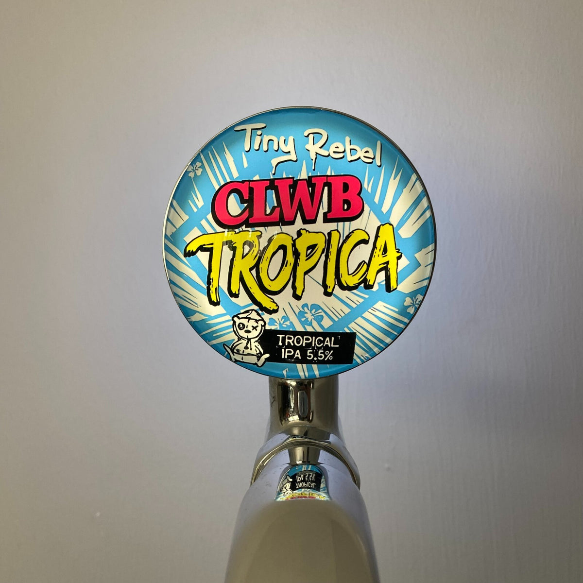 Tiny Rebel Clwb Tropica badge lit up on a beer tap