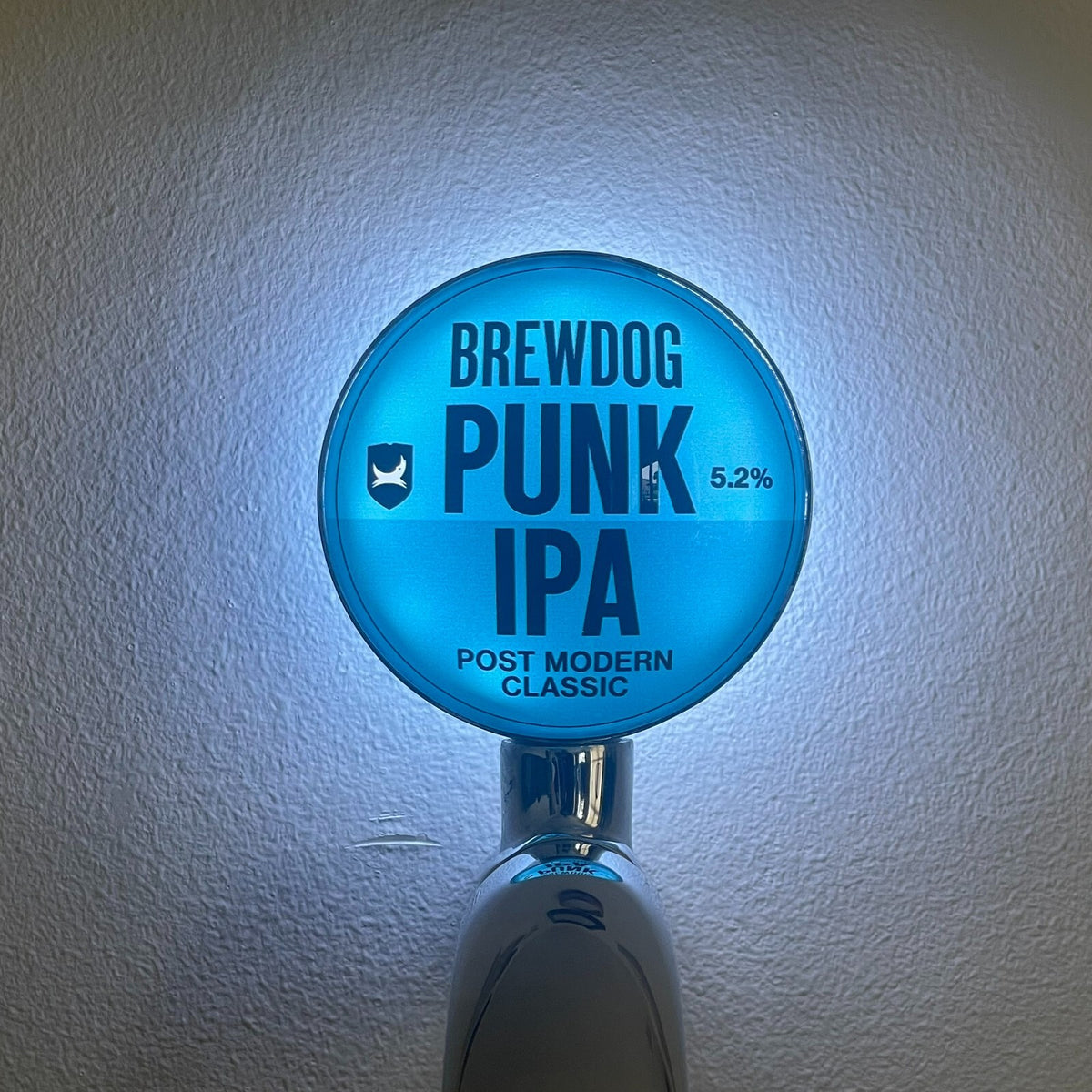 BrewDog Punk IPA badge lit up on a beer tap