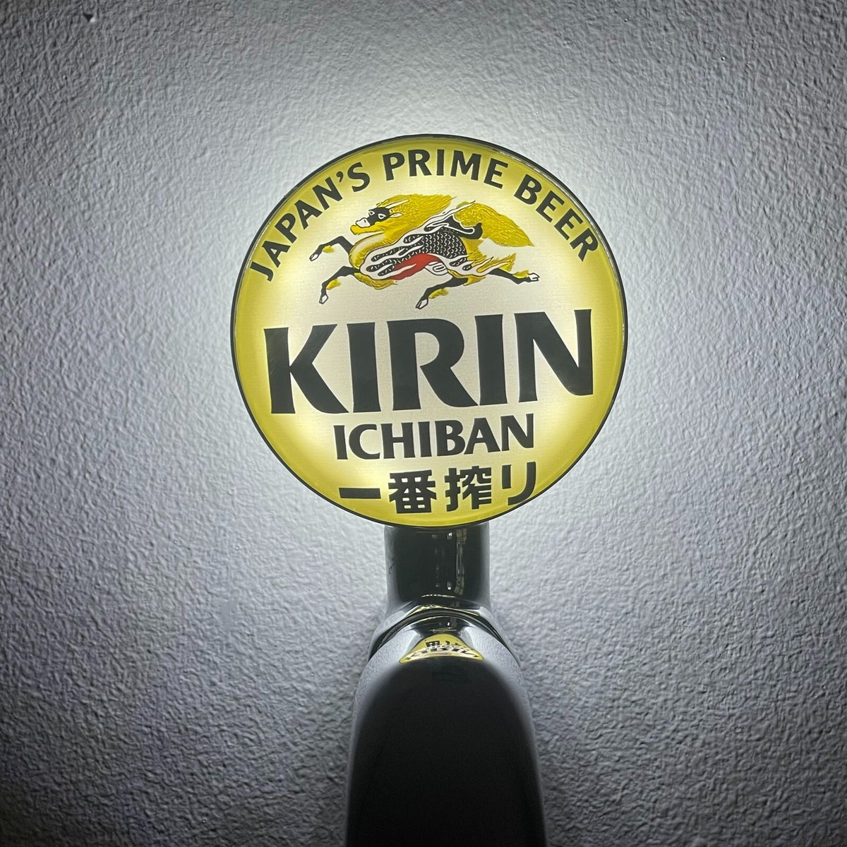 Kirin badge lit up on a beer tap