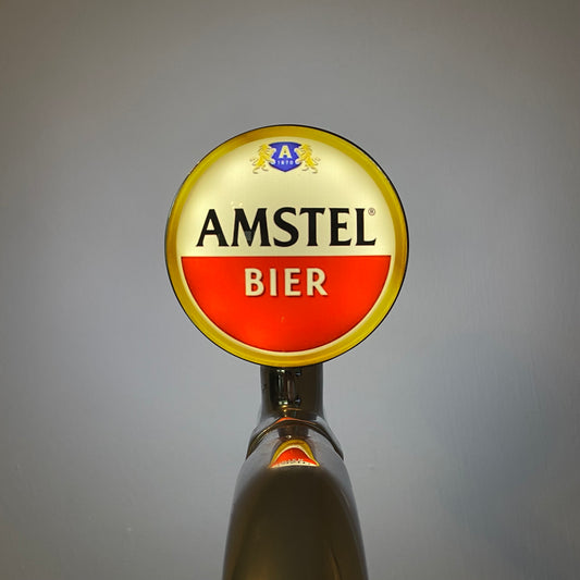 Amstel Badge / Lens