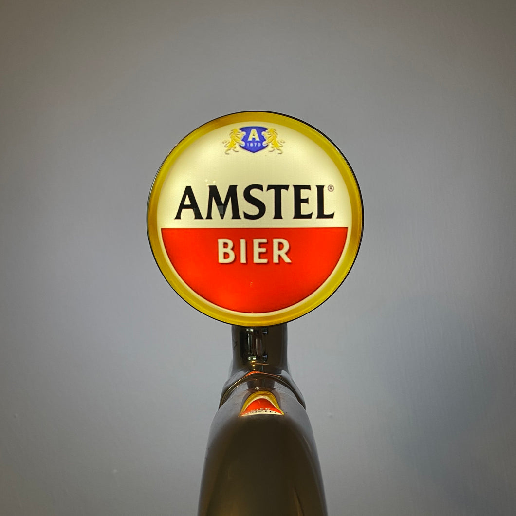 Amstel Badge / Lens