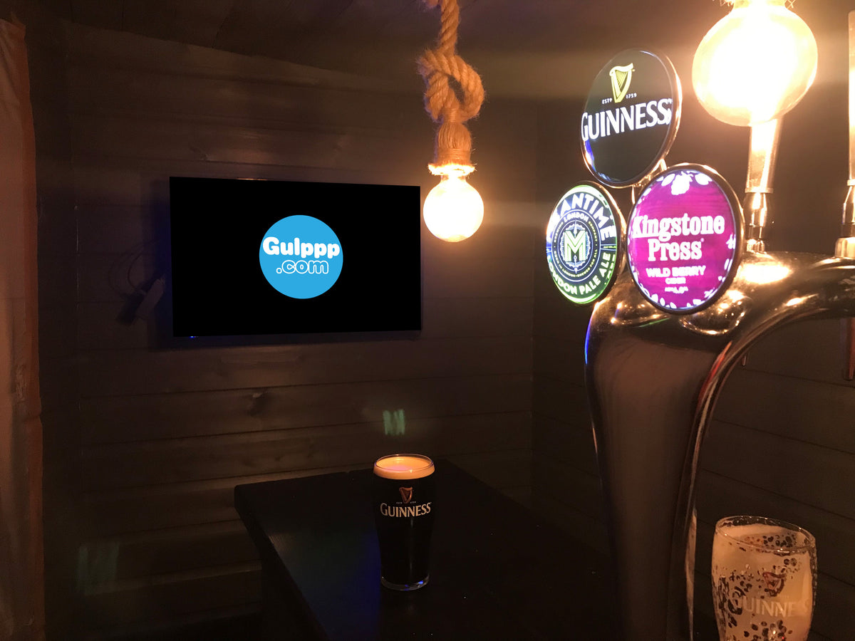 Home bar with a Gulppp hanging pub sign